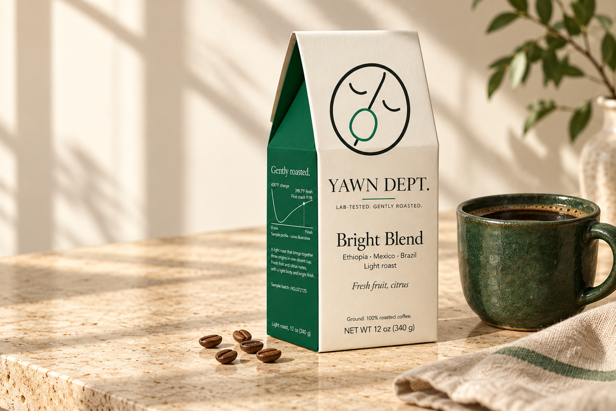 Yawn Dept Bright Blend coffee beside a green ceramic cup in morning light